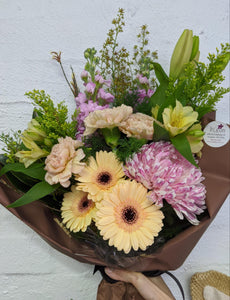 seasonal flowers arranged in a bouquet styled by our talented florists
